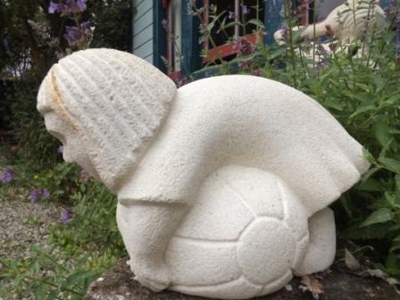 Balancing on a beach ball (in gumboots)
"Hey Gran... ! What's happened to my ball? It's gone a funny shape!"
