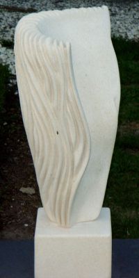 The Answer
I was thinking about grass blowing around in the wind when I was carving this one and then half way through I under went a slight change of mind... deciding that it would be too busy with lots of swaying lines all over it. So I went for a smooth contrast. So this one I feel is very tactile. You can run you fingers along the wavy lines and then enjoy the cool smoothness of the central core.
Stand 600mm high plus 100mm base (SOLD)
